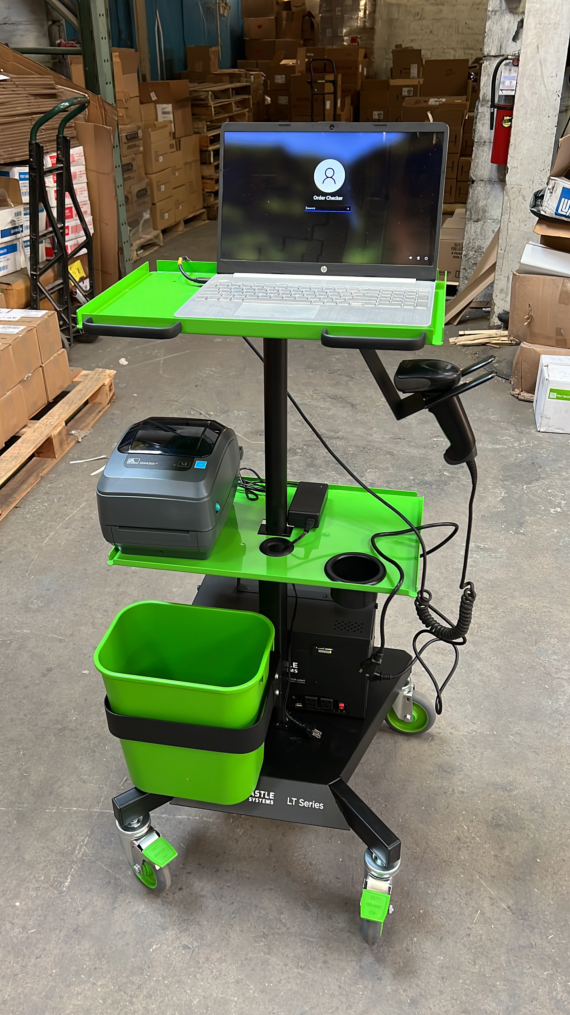 Mobile powered workstation cart with laptop, label printer, and barcode scanner